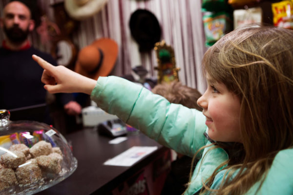 Child pointing at someting in kiosk